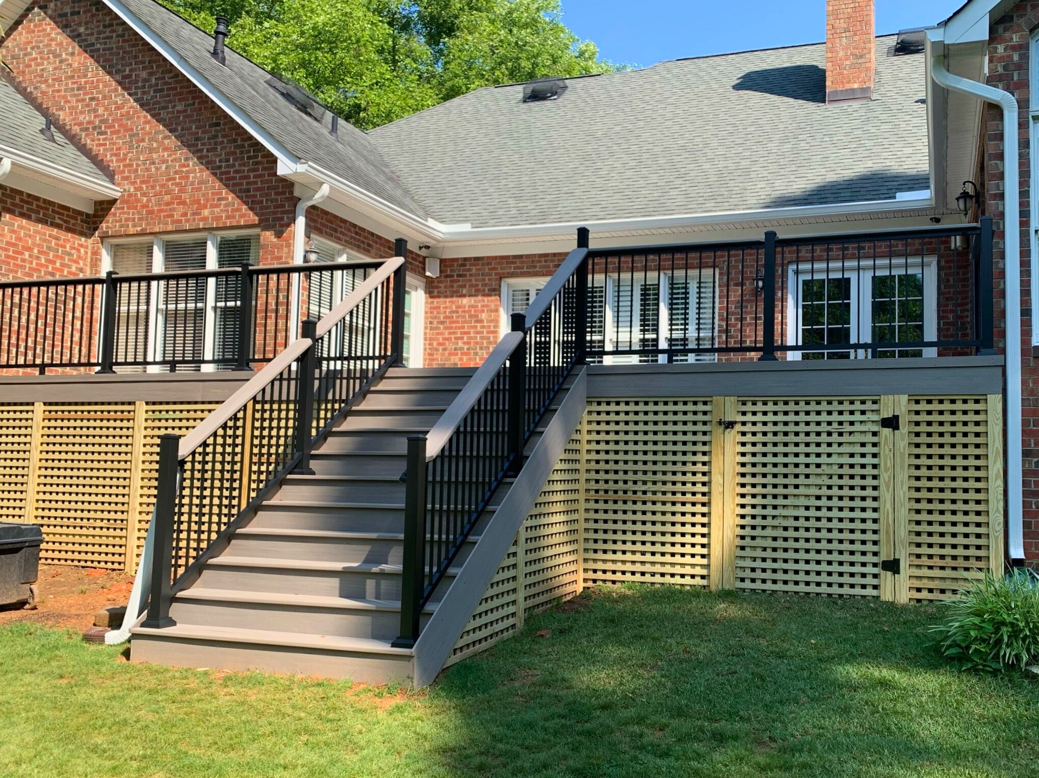 Elevated composite deck with wood lattice skirting in Indian Trail, NC.